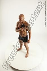 Underwear Fighting with gun Man Black Sitting poses - simple Muscular Bald Sitting poses - ALL Multi angles poses Academic