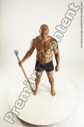 Underwear Fighting with spear Man Black Sitting poses - simple Muscular Bald Sitting poses - ALL Multi angles poses Academic