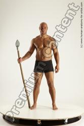 Underwear Fighting with spear Man Black Sitting poses - simple Muscular Bald Sitting poses - ALL Multi angles poses Academic