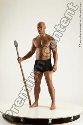 Underwear Fighting with spear Man Black Sitting poses - simple Muscular Bald Sitting poses - ALL Multi angles poses Academic