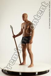 Underwear Fighting with spear Man Black Sitting poses - simple Muscular Bald Sitting poses - ALL Multi angles poses Academic