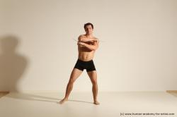 Underwear Fighting Man White Athletic Short Black Dynamic poses Academic