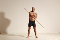 Sportswear Man Black Muscular Bald Dynamic poses Academic