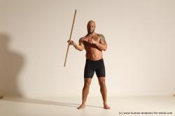 Sportswear Man Black Muscular Bald Dynamic poses Academic