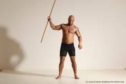 Sportswear Man Black Muscular Bald Dynamic poses Academic