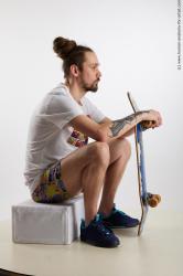 Sportswear Man White Sitting poses - simple Slim Brown Sitting poses - ALL Dreadlocks Standard Photoshoot Academic