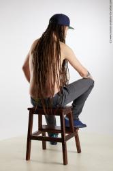 Casual Man White Sitting poses - simple Slim Brown Sitting poses - ALL Dreadlocks Standard Photoshoot Academic