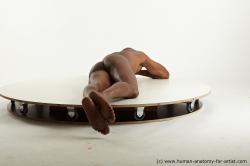 Nude Man Black Laying poses - ALL Slim Bald Laying poses - on stomach Standard Photoshoot Realistic
