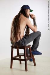 Casual Man White Sitting poses - simple Slim Brown Sitting poses - ALL Dreadlocks Standard Photoshoot Academic