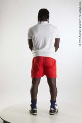 Sportswear Man Black Standing poses - ALL Muscular Black Standing poses - simple Dreadlocks Standard Photoshoot Academic