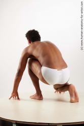 Swimsuit Man Black Kneeling poses - ALL Athletic Short Kneeling poses - on one knee Black Standard Photoshoot Academic