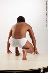 Swimsuit Man Black Kneeling poses - ALL Athletic Short Kneeling poses - on one knee Black Standard Photoshoot Academic